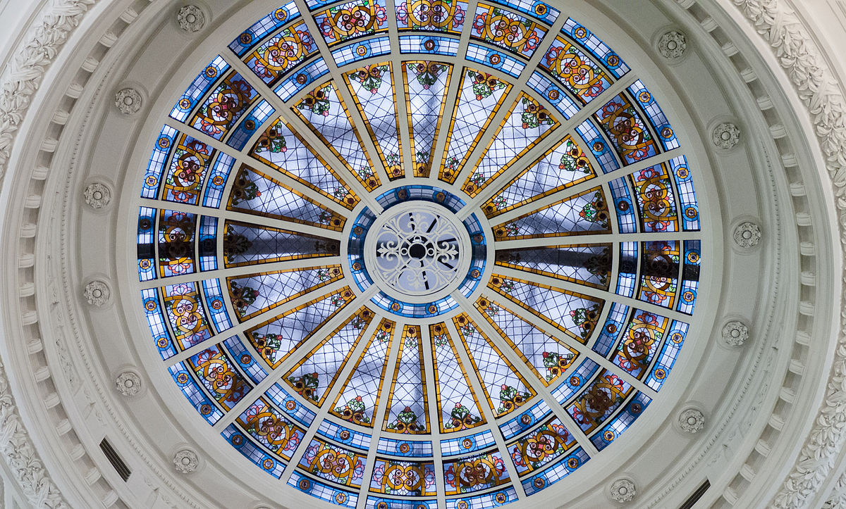 a large clock mounted to the side of a building