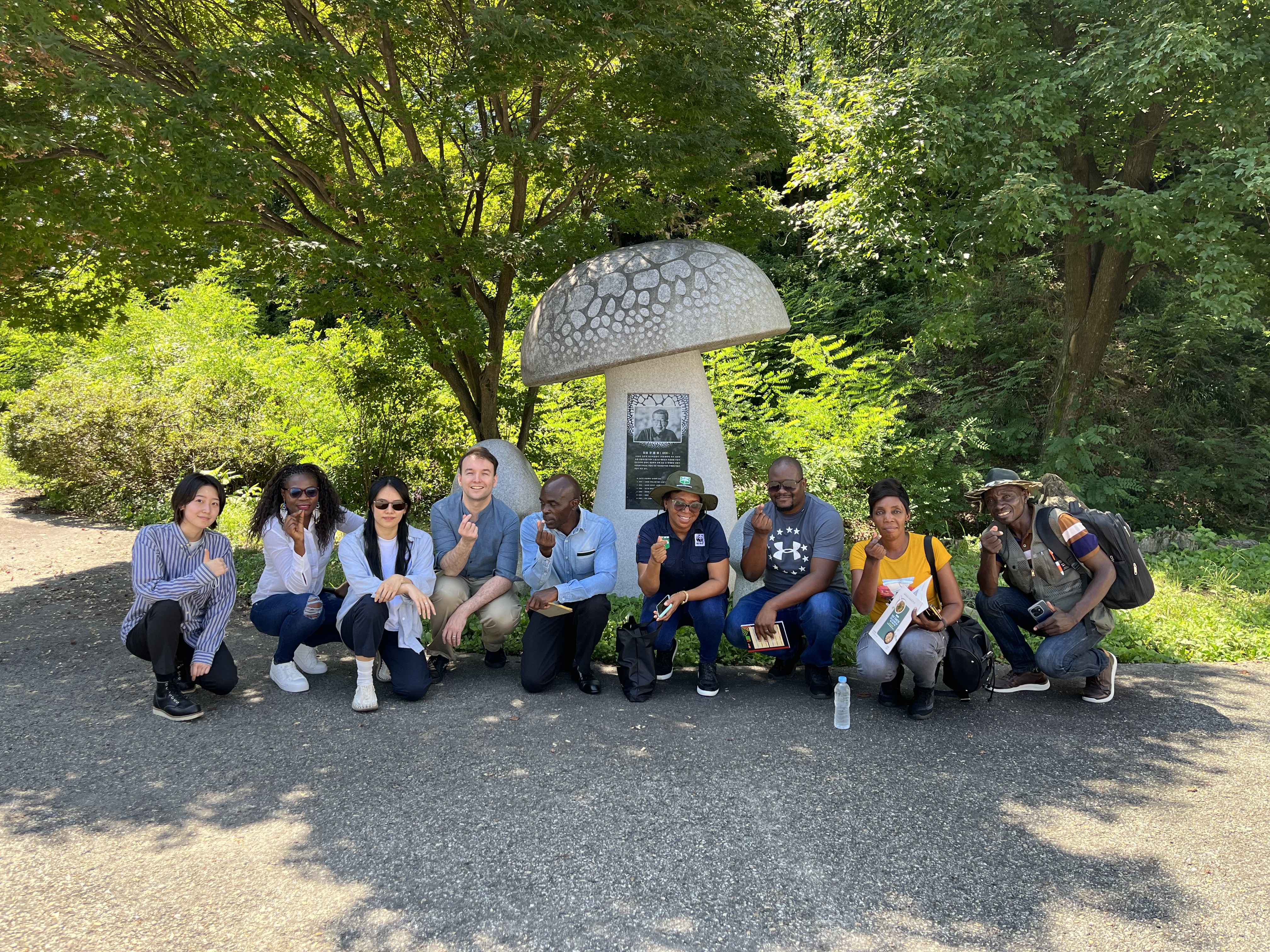 a group of people sitting at a park