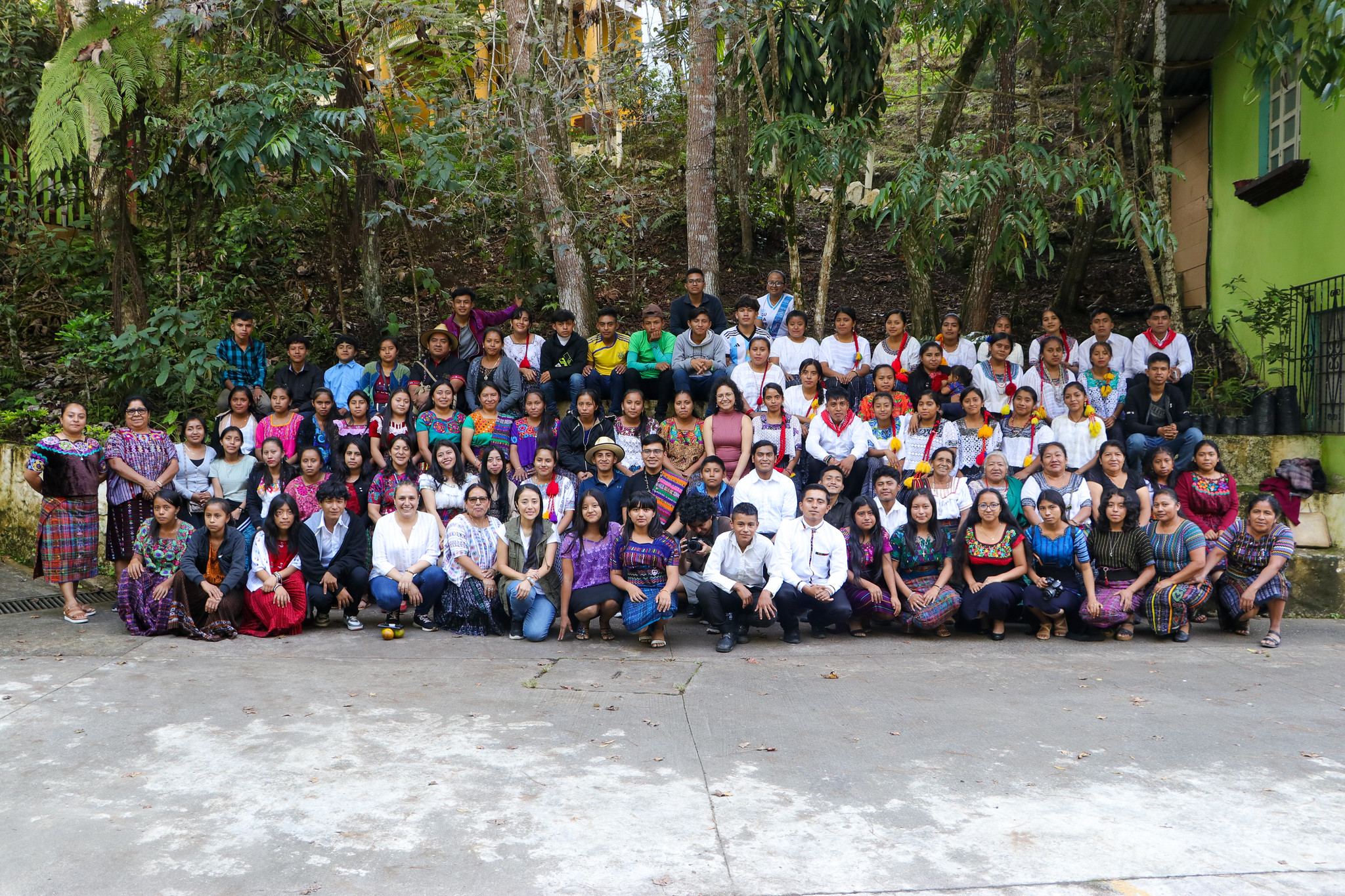 a group of people in front of a crowd posing for the camera