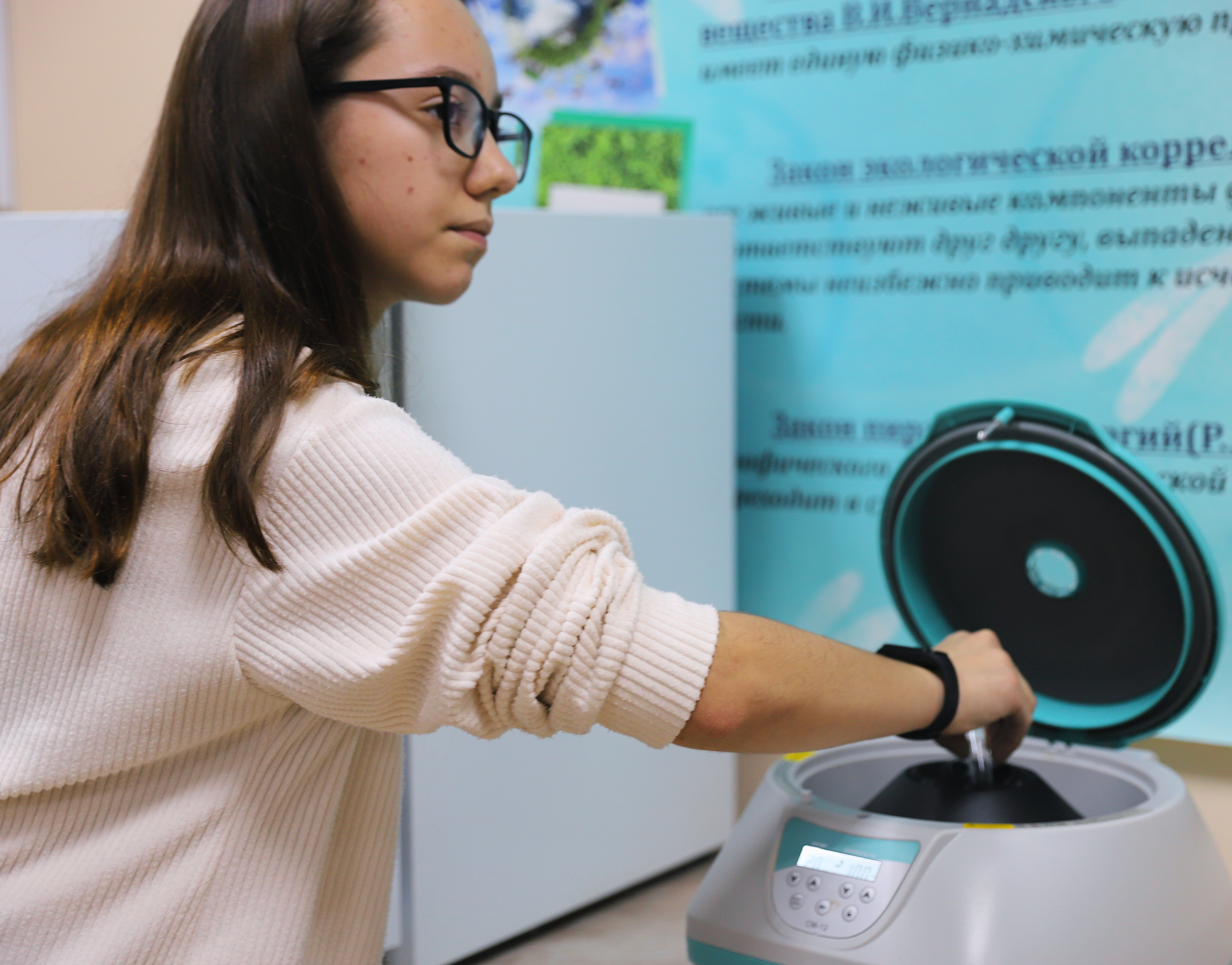 a woman standing in front of a computer