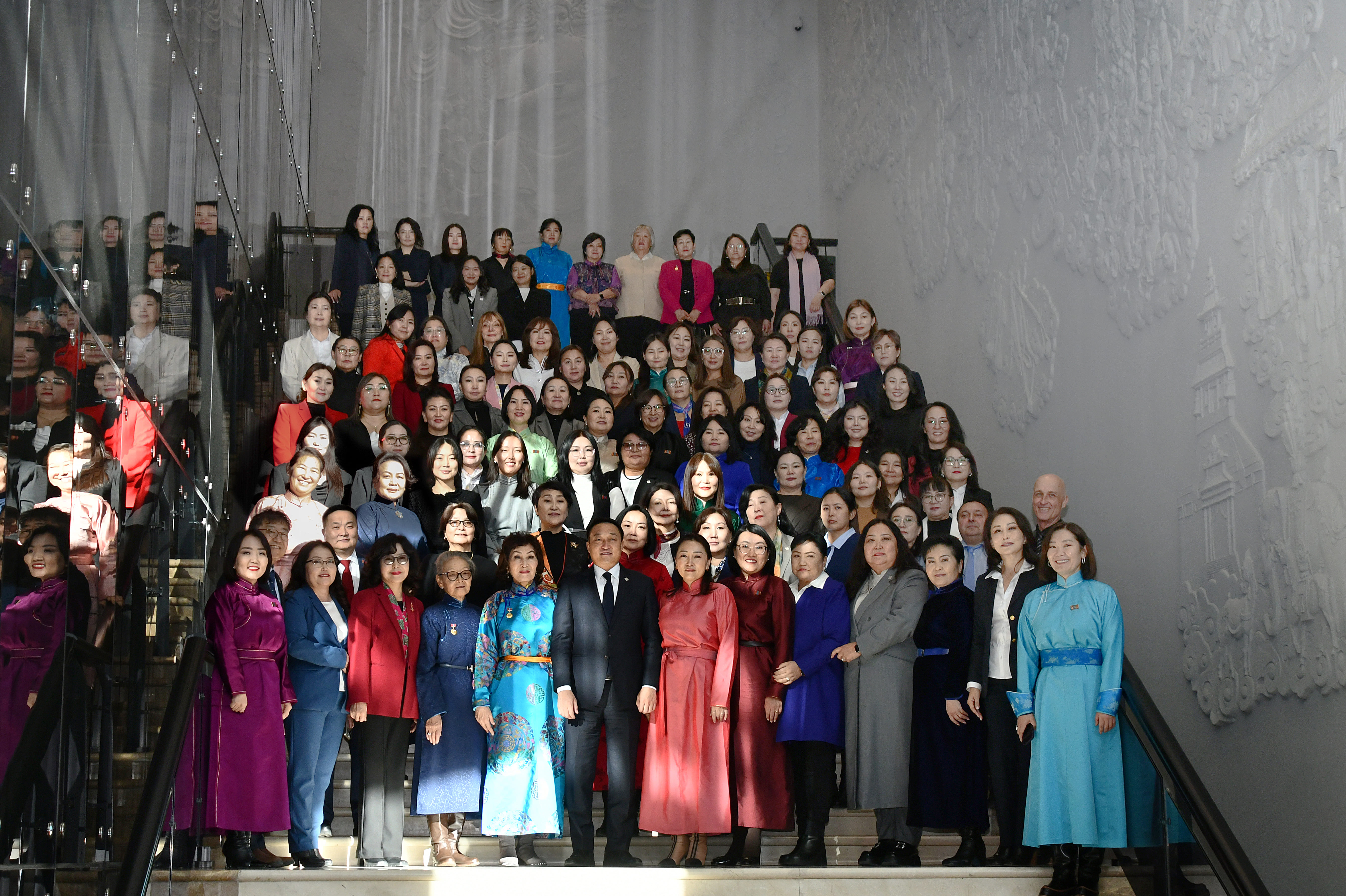 a group of people standing in front of a crowd posing for the camera