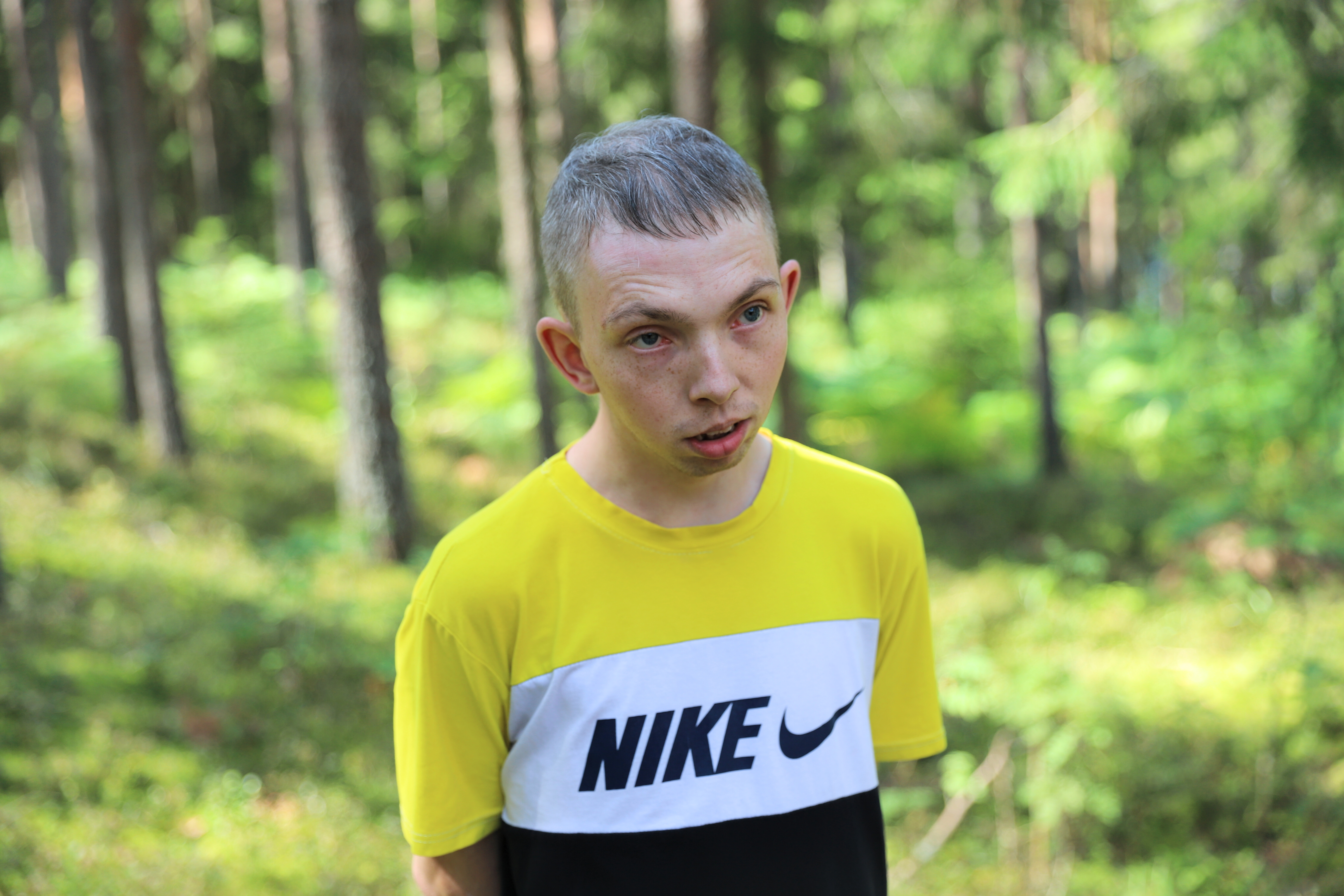 a young man holding a frisbee