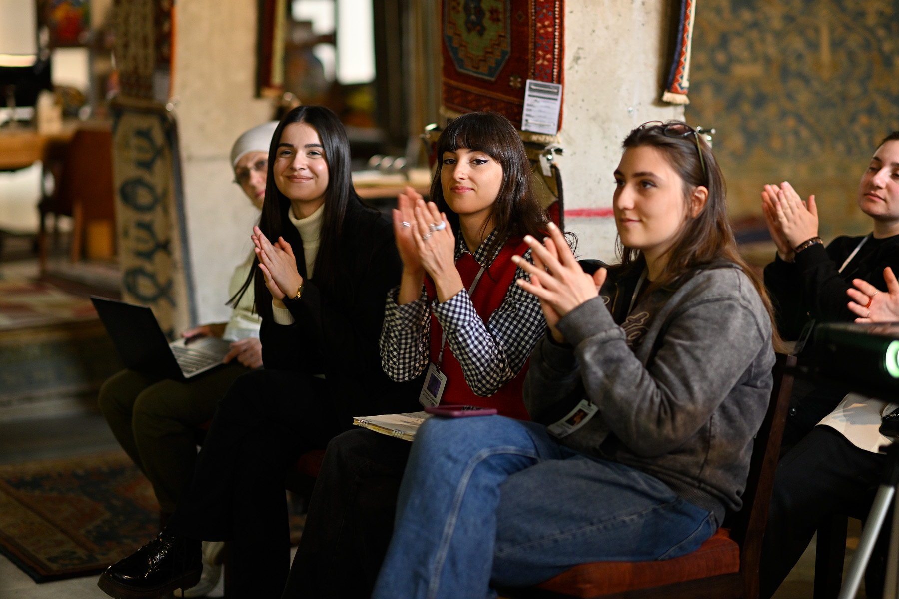 a group of people sitting posing for the camera