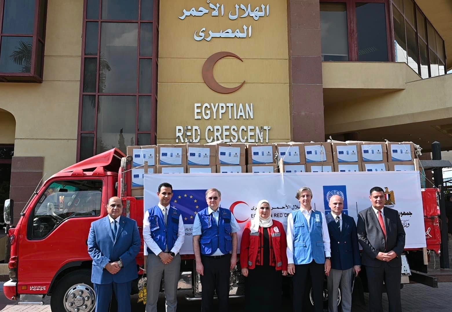 a group of people standing in front of a building