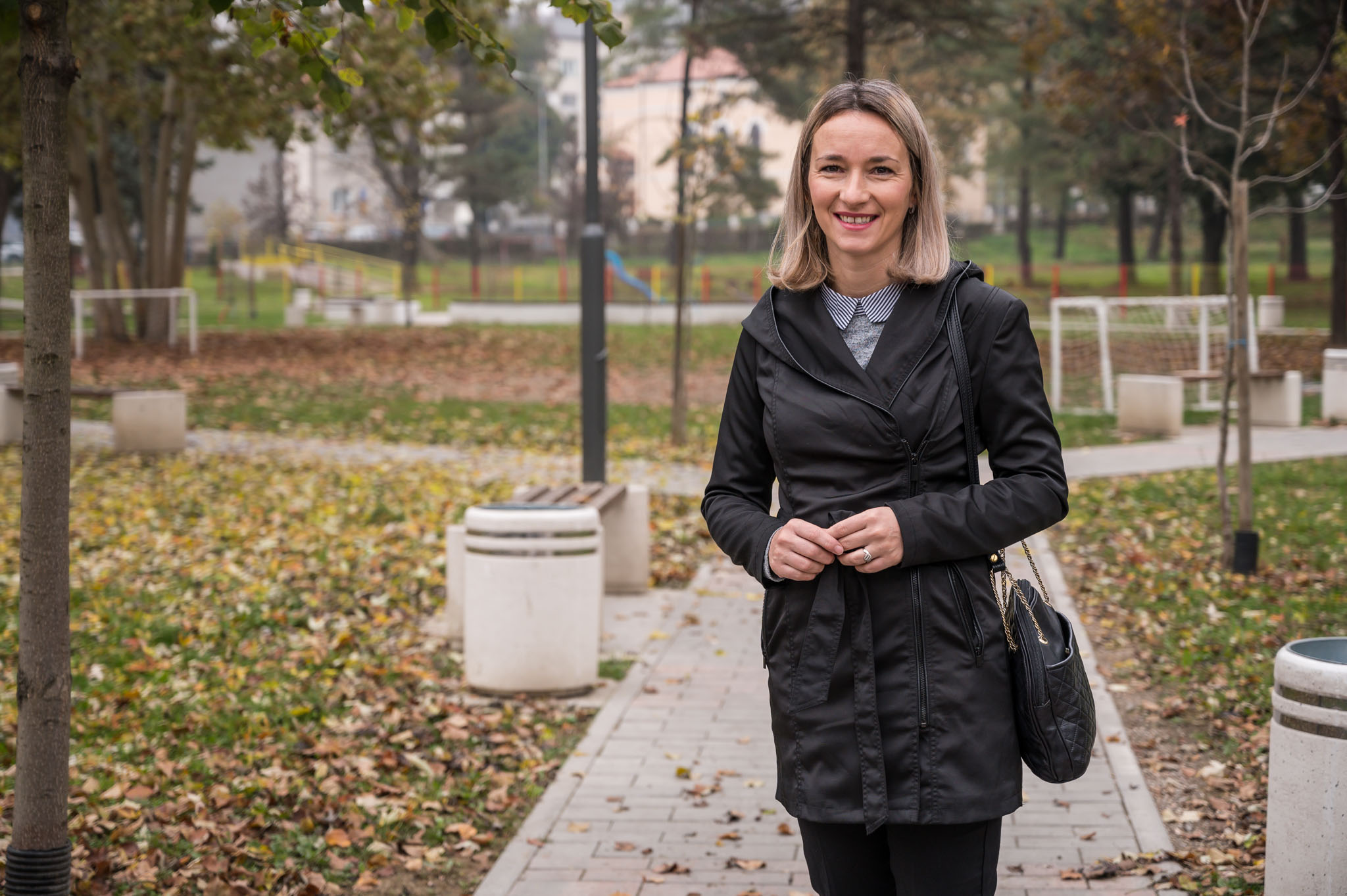 a person standing on a sidewalk