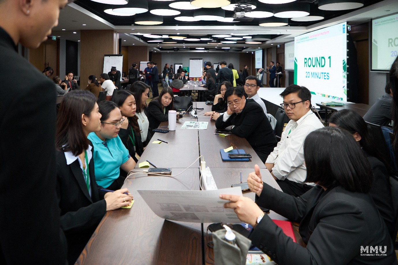 a group of people sitting at a table