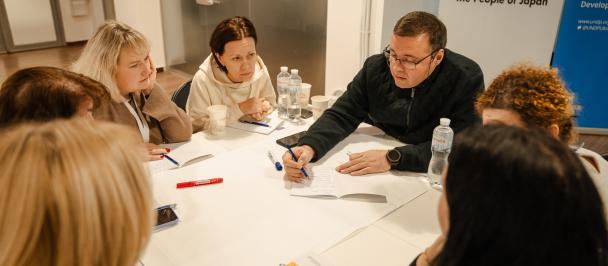 a group of people sitting at a table