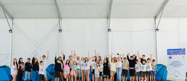 a group of people standing in front of a crowd