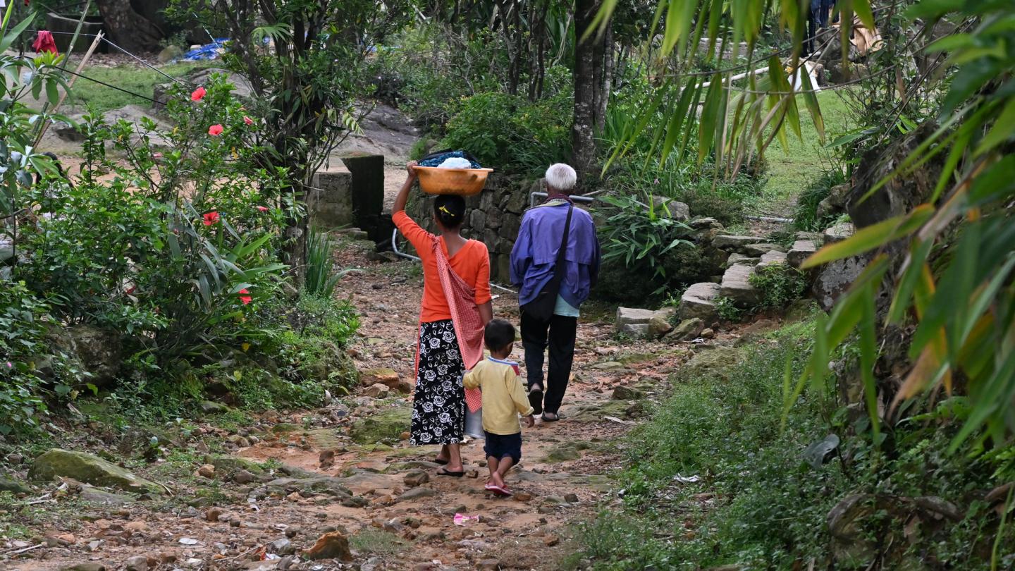 Woman walking with child