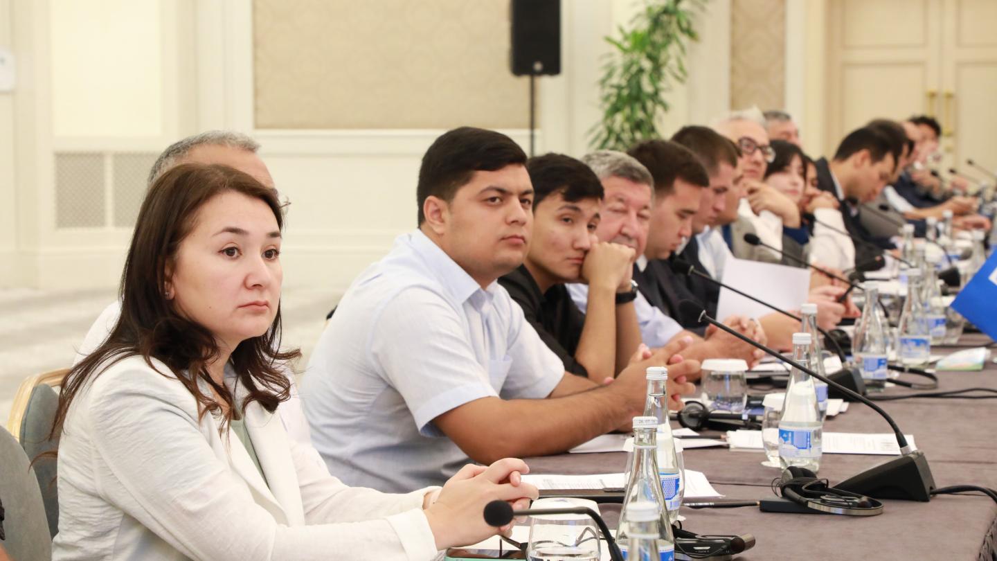 a group of people sitting at a table